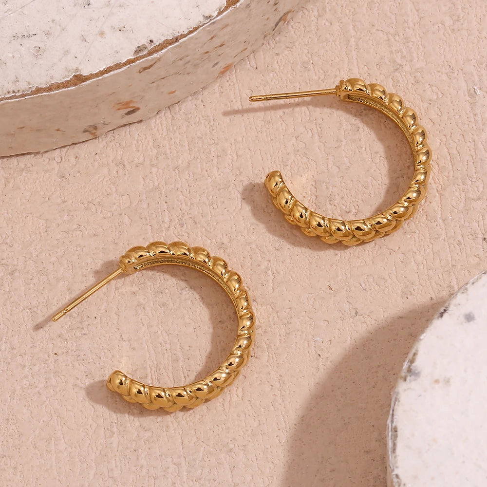 Weizen-Creolen Detailansicht strukturierte Oberfläche Gold